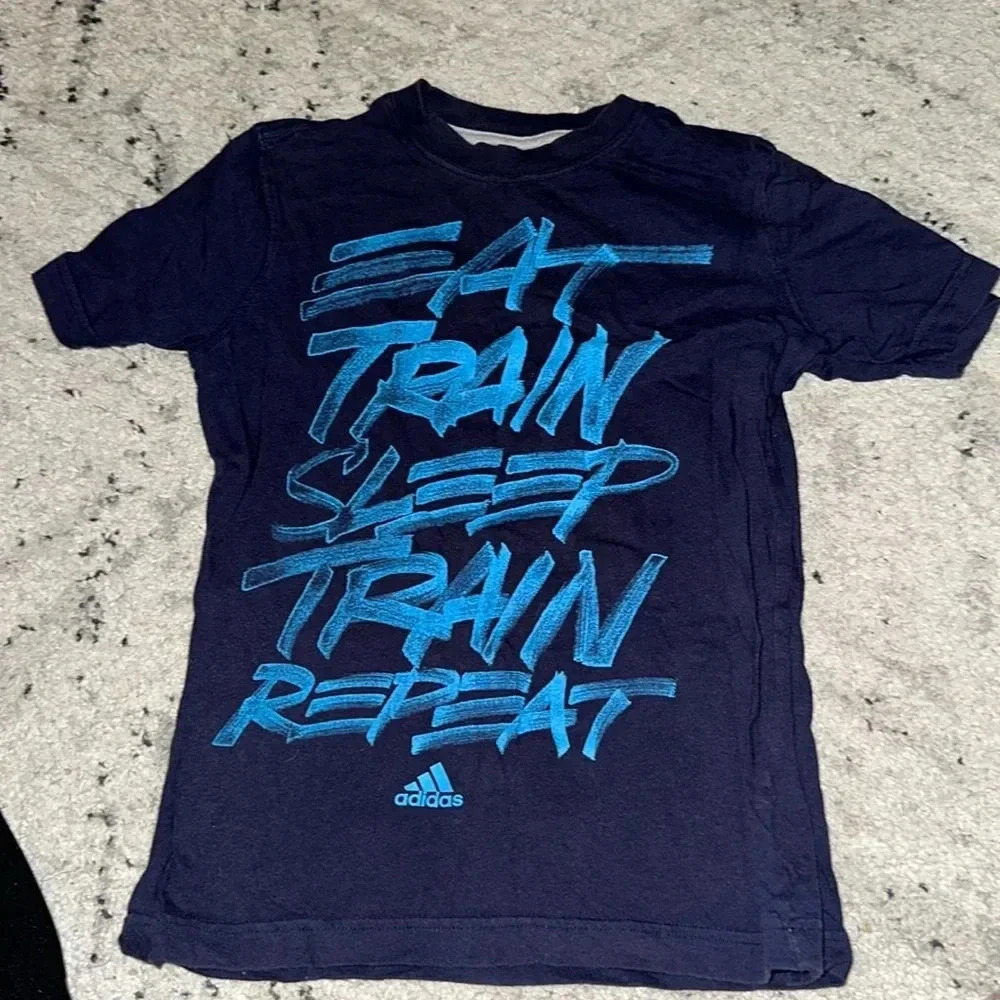 Adidas Boys S/s shirt Blue “ EAT TRAIN SLEEP TRAIN REPEAT” Boys Medium 10/12
